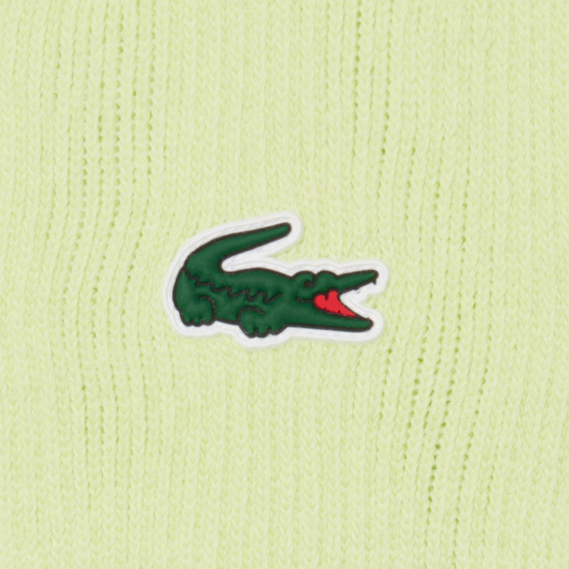 Poignets éponge Lacoste Roland Garros vert : Le détail des champions