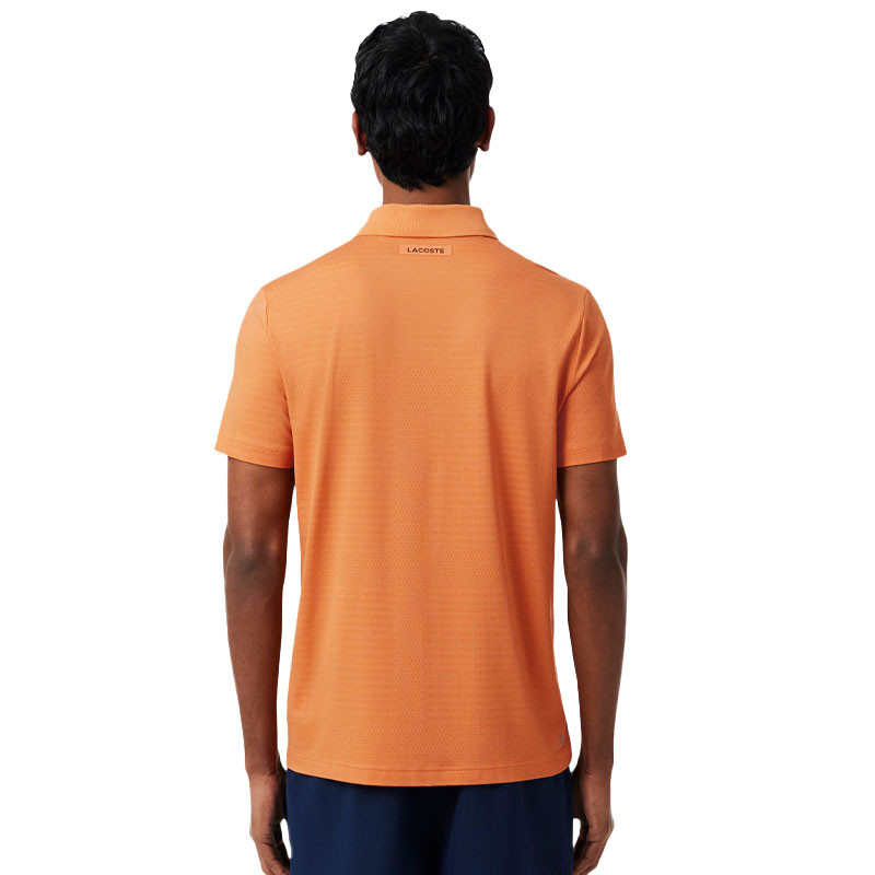Polo de Tennis Lacoste Ultra-Dry orange : L'élégance et la performance