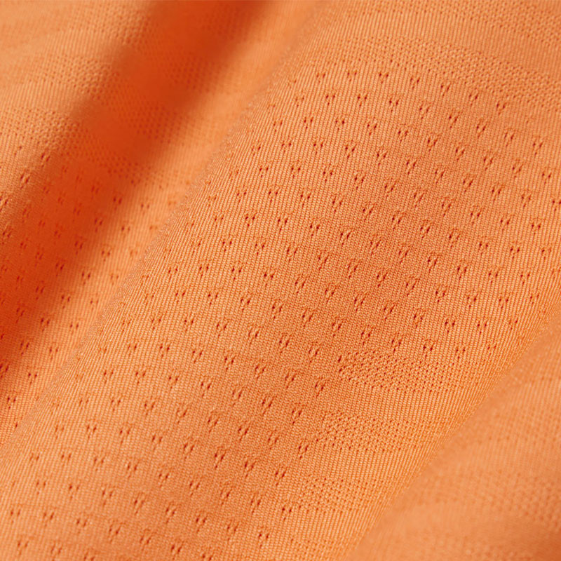 Polo de Tennis Lacoste Ultra-Dry orange : L'élégance et la performance